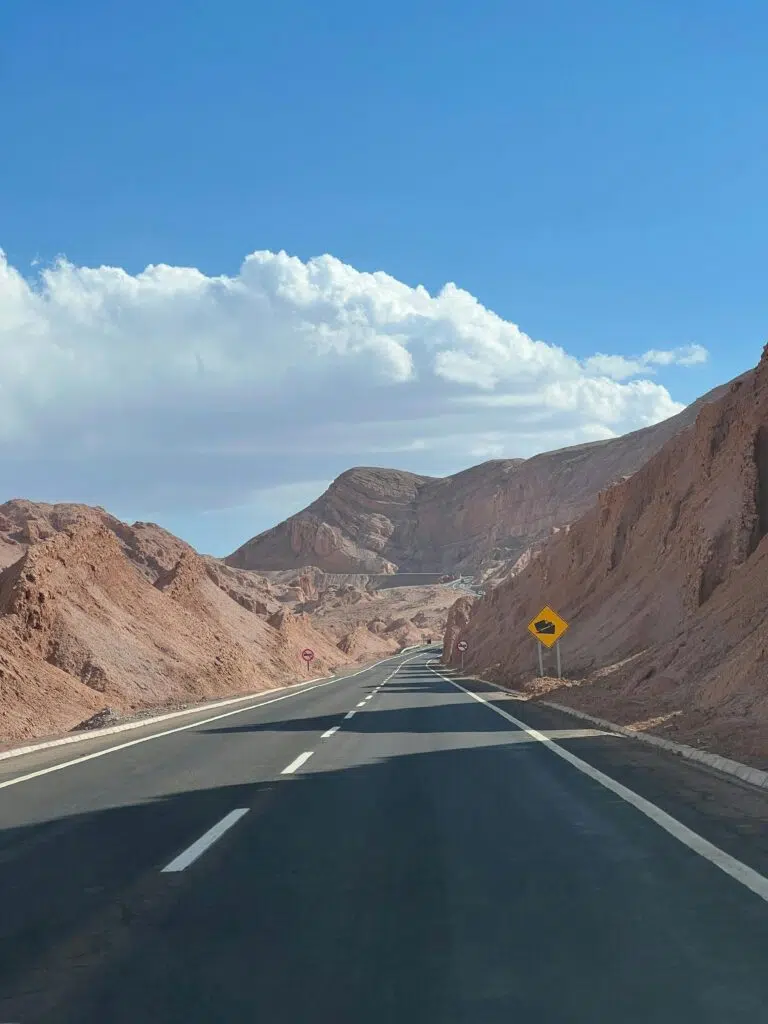 Majestic desert highway view in San Pedro de Atacama, Chile under vibrant sky.